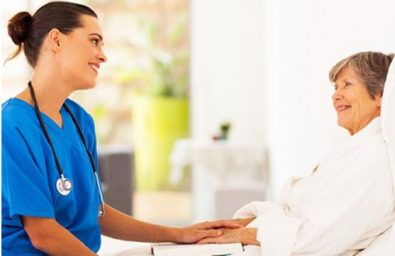 nurse caring for elderly woman